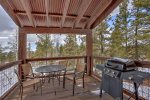 Back deck with gas grill and table/chairs